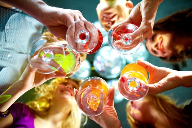 Bottom view of a group of people holding drinks