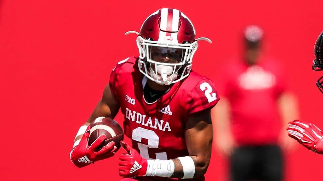 Indiana Hoosiers football player carrying football